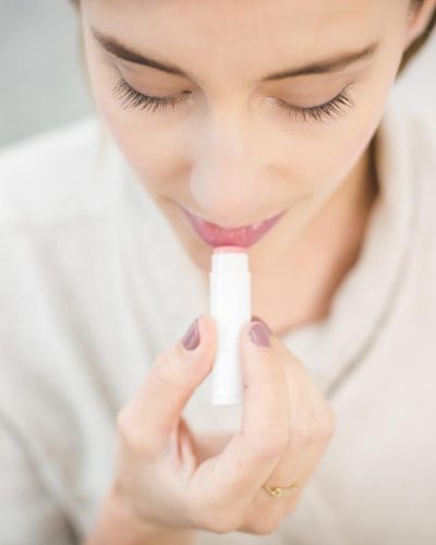 woman-applying-lip-balm.jpg
